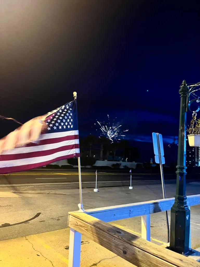 American flag at Buster's Beer and Bait at night